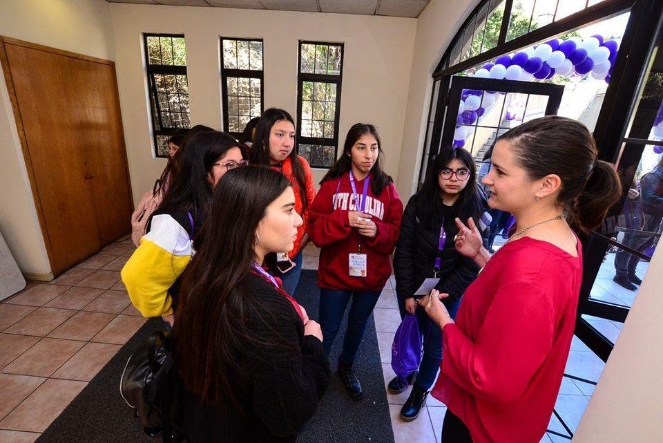 Pilar Dueñas in conversation with a small group of students